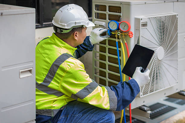 Professional Heat Pump Repair technician working in Flushing, NY